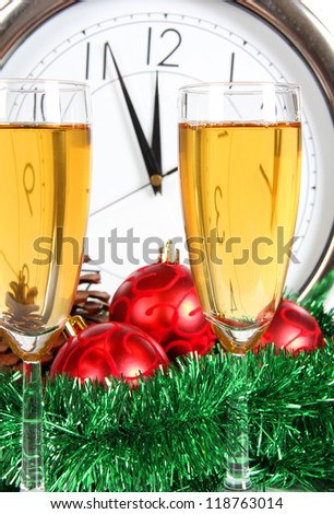 Color photo of glasses of champagne and watch dial