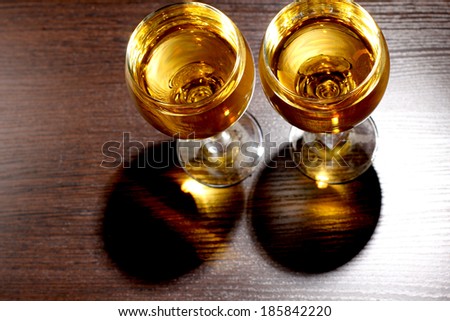 Luxury old whiskey glass on wood background