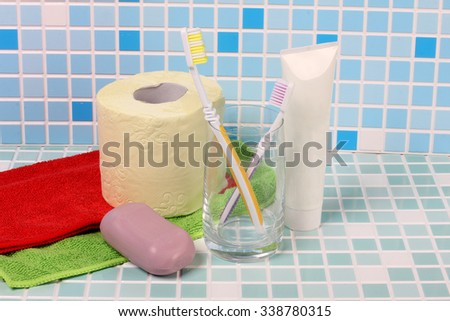 Toothbrush and soap on a tile in bathroom