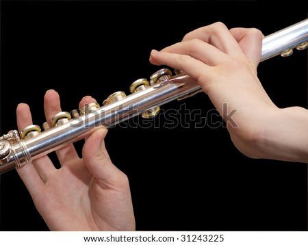 The image on the theme of musical instruments. Flute in the women\'s hands.