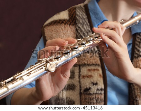 Color photo of the flute in the hands of women