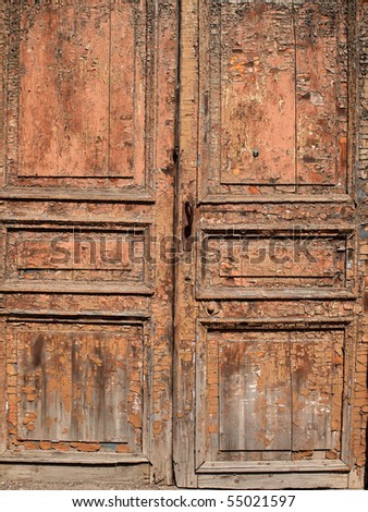 Color photograph of old dirty doors on historic building