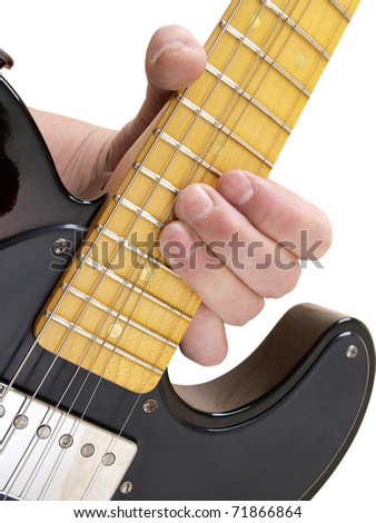 Color photo of electric guitar and hand