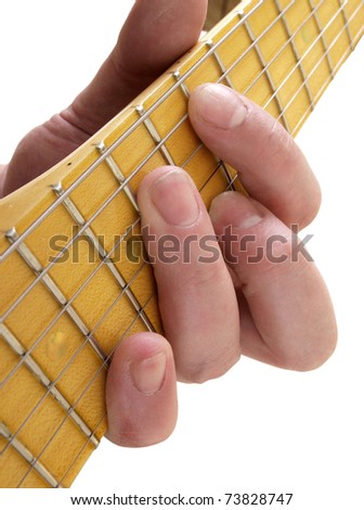 Color photo of electric guitar and hand