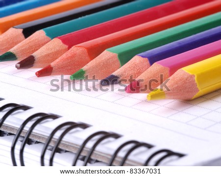 Color photo of a set of pencils on notepad