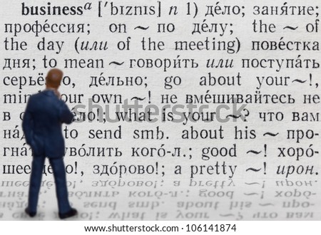 Figure of businessman who thinks about meaning of word 