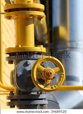 The gas gate, yellow valve and yellow pipes.