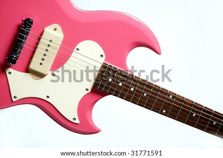 A pink electric guitar isolated against a white background in the horizontal format.
