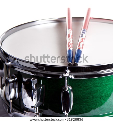 A green snare drum with sticks isolated against a white background in the square format.