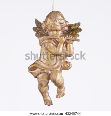 An angel playing a flute ornament against a white background in the square format.