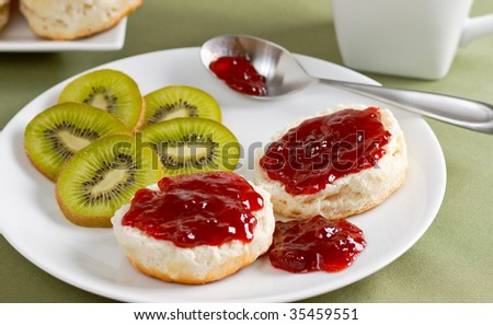 Fresh homemade buttermilk biscuits with strawberry jelly