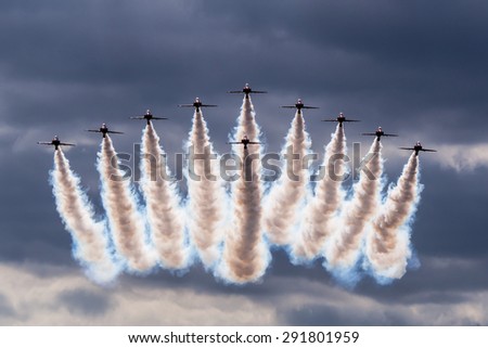 GUILDFORD, SURREY/UK - JUNE 27 2015: Red Arrows RAF display team flyover at Armed Forces Day