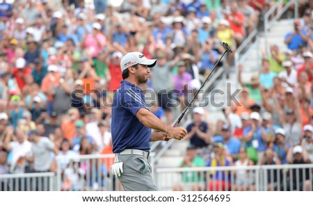 EDISON,NJ-AUGUST 30:Jason Day reacts with the fans after making his final putt on the 18th hole during the Barclays Tournament held at the Plainfield Country Club in Edison,NJ,August 30,2015.