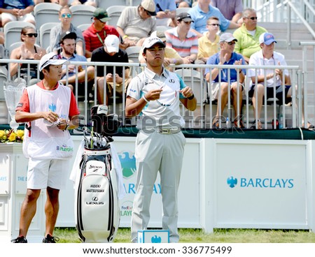 EDISON,NJ-AUGUST 30:Hideki Matsuyama (r) looks down the 1st Tee Fairway during the final round of the Barclays Tournament held at the Plainfield Country Club in Edison,NJ,August 30,2015.
