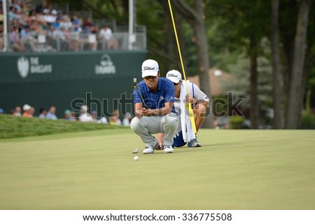 EDISON,NJ-AUGUST 30:Kevin Na (front) lines up his putt on the 18th Hole during the final round of the Barclays Tournament held at the Plainfield Country Club in Edison,NJ,August 30,2015.