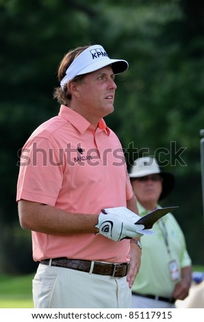 EDISON,NJ-AUGUST 24: Golfer Phil Mickelson studies his approach during the Barclays pro-am held at the Plainfield Country Club on August 24,2011 in Edison,NJ.