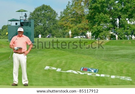 EDISON,NJ-AUGUST 24: Golfer Phil Mickelson studies the green during the Barclays pro-am held at the Plainfield Country Club on August 24,2011 in Edison,NJ.