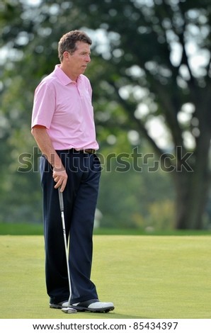 EDISON,NJ-AUGUST 24: Barclays CEO Robert Diamond takes a look at the green during the Barclays pro-am held at the Plainfield Country Club on August 24,2011 in Edison,NJ.
