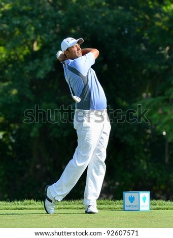 EDISON,NJ AUGUST 26:Golfer Arjun Atwal watches his shot during the second round of the Barclays Tournament held at the Plainfield Country Club on August 26,2011 in Edison,N.J.