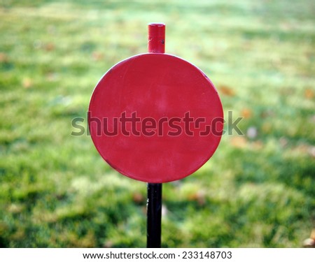 Close-up of a red railroad signal.