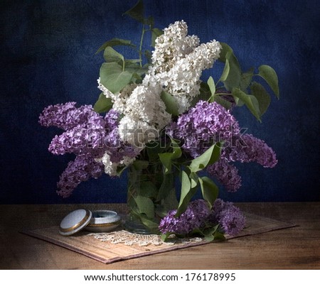 bouquet of spring purple Lilac in a vase. Still life