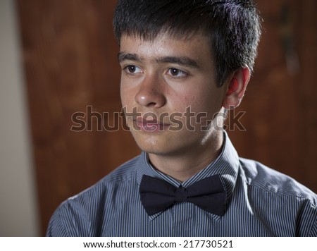 Formal portrait of a teenage boy in a suit and tie.