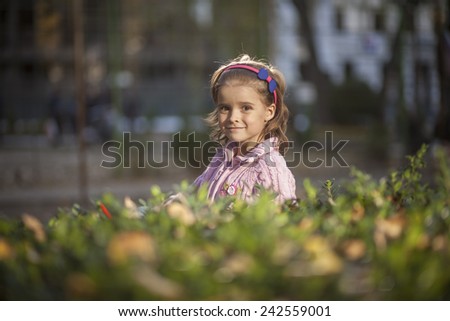Natural portrait of a happy pretty little girl