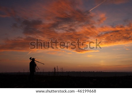 sunset silhouette of a photographer