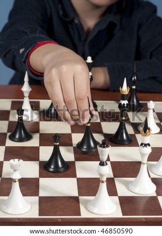 hand of a player making ocombinatie in chess