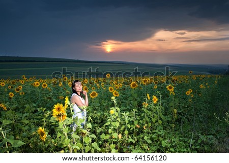 lady, full of life with sunflower field