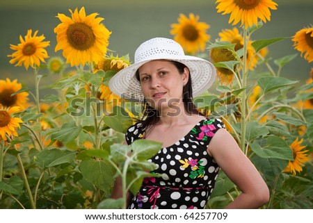 lady full of life with sunflower field