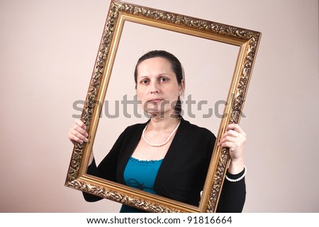 beautiful woman framed in a antique frame