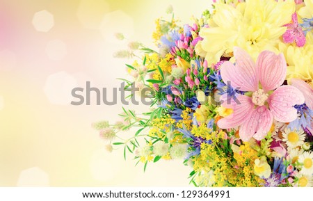 Bouquet of summer flowers with bokeh and copy space