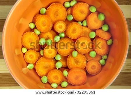 Mixed parts of carrot and green peas in ceramic ware