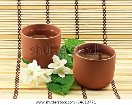 Two clay cups with jasmin green tea
