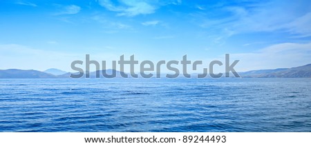 Summer panoramic view of the  sea and mountain range