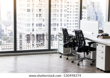 Modern office with open space to work thought the window and background city.