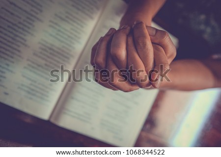 Close up prayer\'s hand pray in church, Pastor pray to God with BIBLE, top view with blank copy space