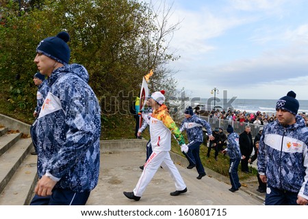 SVETLOGORSK, RUSSIA - OCTOBER 29: Olympic torch bearer participates in relay of Olympic Flame on October 29, 2013 in Svetlogorsk, Russia.