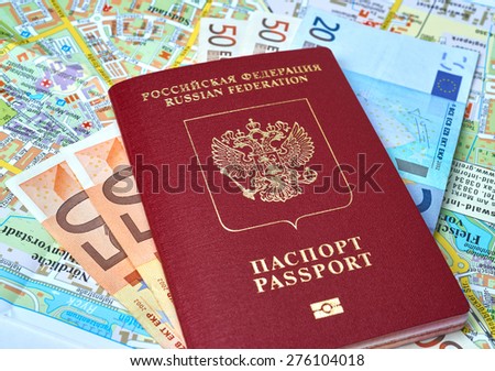 Russian passport and Euro banknotes on the map background