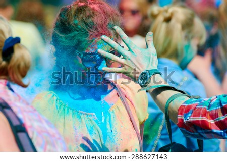 KALININGRAD, RUSSIA - JUNE 12, 2015: Unidentified people during Holi Festival of Colors, the event is timed to the Day of Russia.