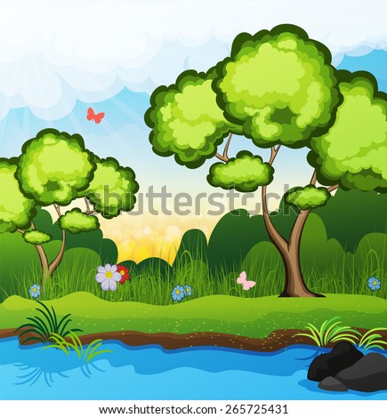 Two trees on the riverbank. Butterflies fly over the grass. spring landscape