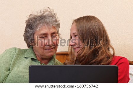 Mother and her daughter surfing on the internet