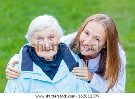 Portrait of elderly woman and her caregiver