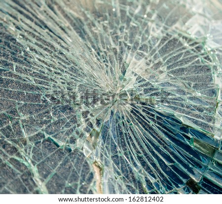 Close up photo of a broken windshield