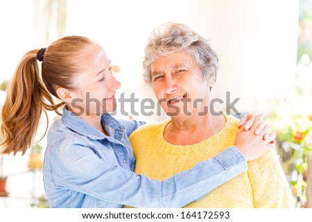 Elderly woman and her daughter enjoying themselves