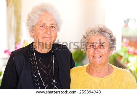 Photo of elderly women smiling to the camera