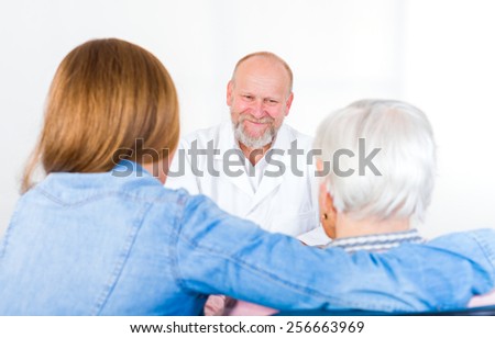 Photo of elderly woman with her grandchild at the doctor