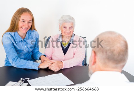 Photo of elderly woman with her grandchild at the doctor