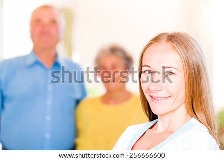Photo of an elderly couple with the caregiver